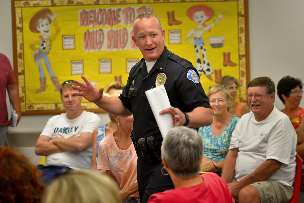 Lt. Thomas DaRé of the Garden Grove Police Department enters the room to talk to people attending a West Garden Grove Neighborhood Watch meeting July 23 about recent crime trends in the area. Photo by Steven Georges/Behind the Badge OC