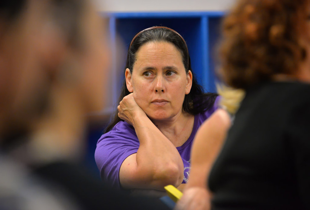 Linda Georges listens to residents feedback as Garden Grove PD Lieutenant Thomas DaRé addresses a West Garden Grove Neighborhood Watch meeting. Photo by Steven Georges/Behind the Badge OC