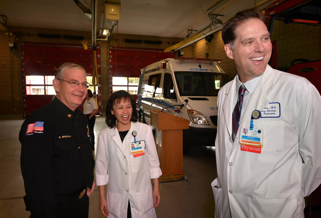 Anaheim Fire & Rescue Chief Randy Bruegman, left, with Dr. Nancy Gin, Area Medical Director of Orange County Service Area and Dr. Todd Newton, a physician with Kaiser Permanente’s Emergency Department, during a press conference at Anaheim Fire Station 11 to announce Anaheim’s new nurse in ambulance program that includes the CCRU-1. (Community Care Response Unit) Photo by Steven Georges/Behind the Badge OC