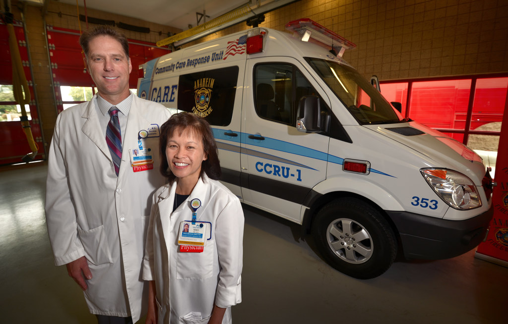Dr. Todd Newton, a physician with Kaiser Permanente’s Emergency Department, left, with Dr. Nancy Gin, Area Medical Director of Orange County Service Area, in front of Anaheim’s new CCRU-1. (Community Care Response Unit) Photo by Steven Georges/Behind the Badge OC