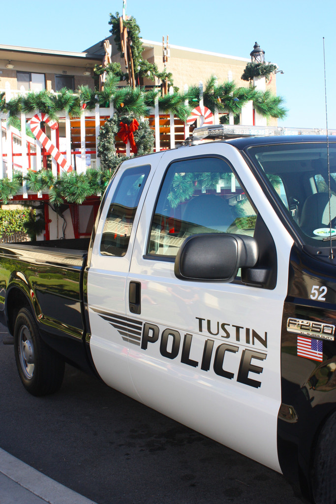 Tustin Police donated their sleigh to deliver gifts to needy families at the Village of Hope for the inaugural Christmas in July. 