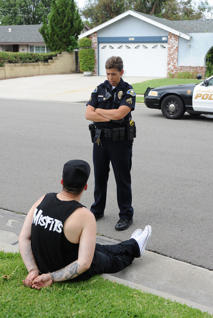Alisha Halczyn, of the Anaheim Police Department, questions a suspect who was carrying a bag with a loaded gun and drugs in Anaheim Hills, Calif., on Monday, July 20, 2015. Photo by Carlos Delgado  /  Behind the Badge OC