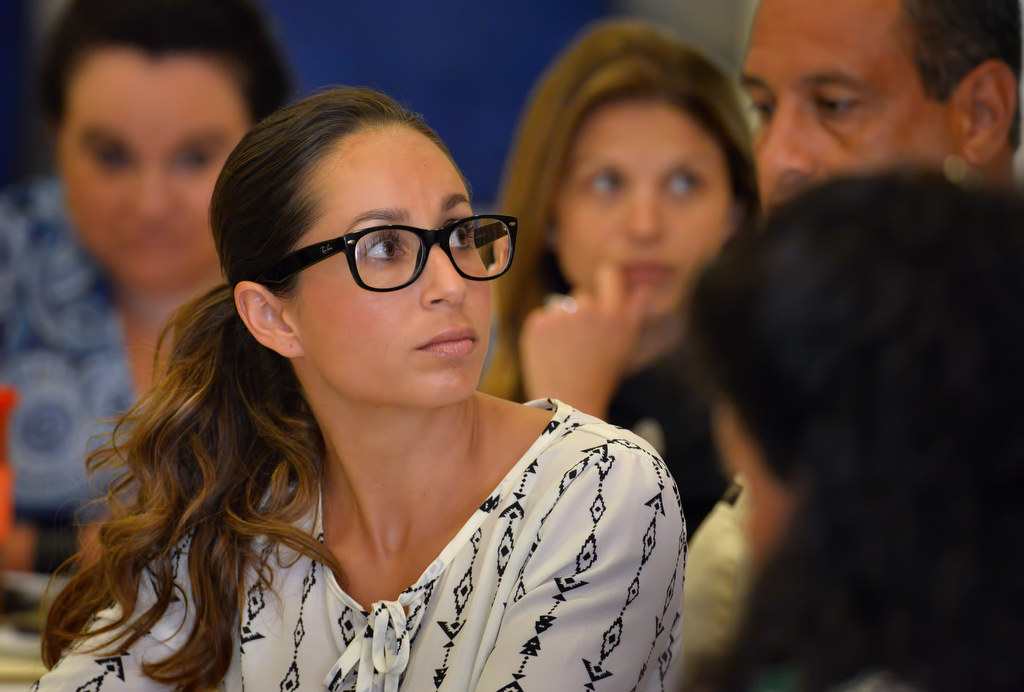 Gisette Uthoff, Psy.D. psychological assistant with the Counseling Team International, listens to keynote speaker Ryan Dedmon, an ex Anaheim PD dispatcher, during an Orange County Peer Support meeting at the Fullerton Community Center. Photo by Steven Georges/Behind the Badge OC