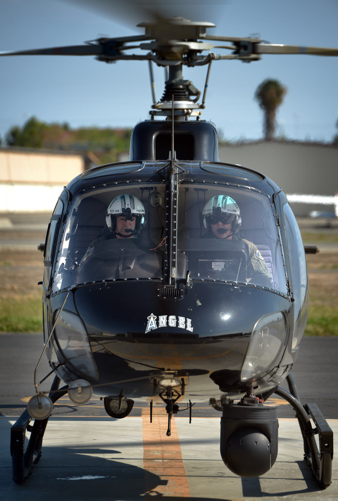 Anaheim PD’s Air Support Bureau helicopter pilots Dietrich Miessner, left, and Jimmy Elliott land the PD’s helicopter Angel at the Fullerton Airport where they are stationed. Photo by Steven Georges/Behind the Badge OC