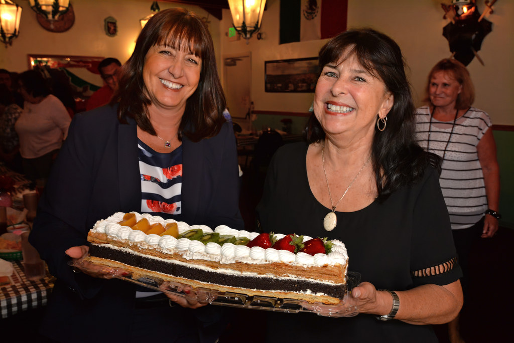 Retired GGPD Sgt. Elaine Noce, left, with Nancy McFaul, retired GGPD crime analysts manager, with a special desert given to the GGPD retired group by Casa de Soto restaurant in Garden Grove on their last meeting at the restaurant due to it closing. Photo by Steven Georges/Behind the Badge OC