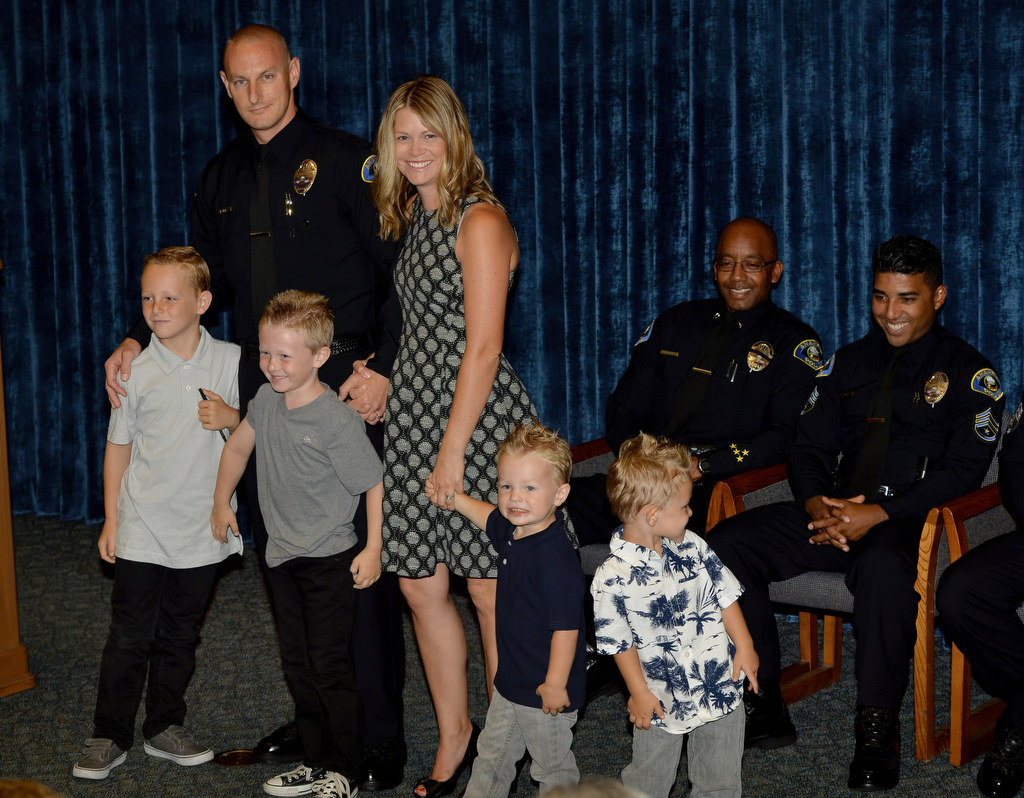 Mark Gell stands with his family, wife Kirsten and four kids, Logan, 8, Blake, 6, and twins Easton and Braden, 3, after receiving his Anaheim officer badge. Gell comes from Long Beach PD. Photo by Steven Georges/Behind the Badge OC