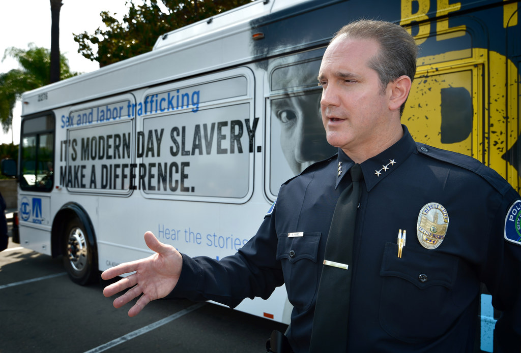 Irvine PD’s Deputy Chief Mike Hamel talks about Irvine’s involvement with the Orange County Human Trafficking Task Force while standing in front of an OCTA buss displaying a new message asking for the public’s help in stoping sex and labor human trafficking. Photo by Steven Georges/Behind the Badge OC