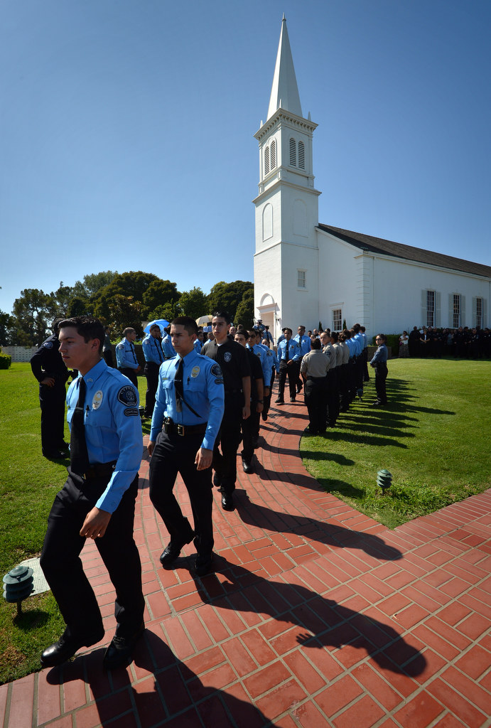 Police explorers from Cypress file out after a memorial service for Buena Park Explorer Vince Parra at Forest Lawn Memorial Park in Cypress. Photo by Steven Georges/Behind the Badge OC