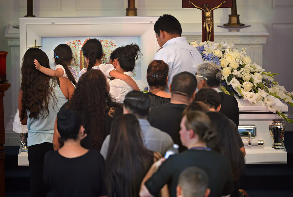 Family members and friends line up to view 18-year-old Buena Park Explorer Vince Parra for the last time during an open casket memorial service. Photo by Steven Georges/Behind the Badge OC