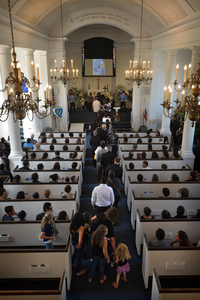 Family members and friends line up to view 18-year-old Buena Park Explorer Vince Parra for the last time during an open casket memorial service. Photo by Steven Georges/Behind the Badge OC