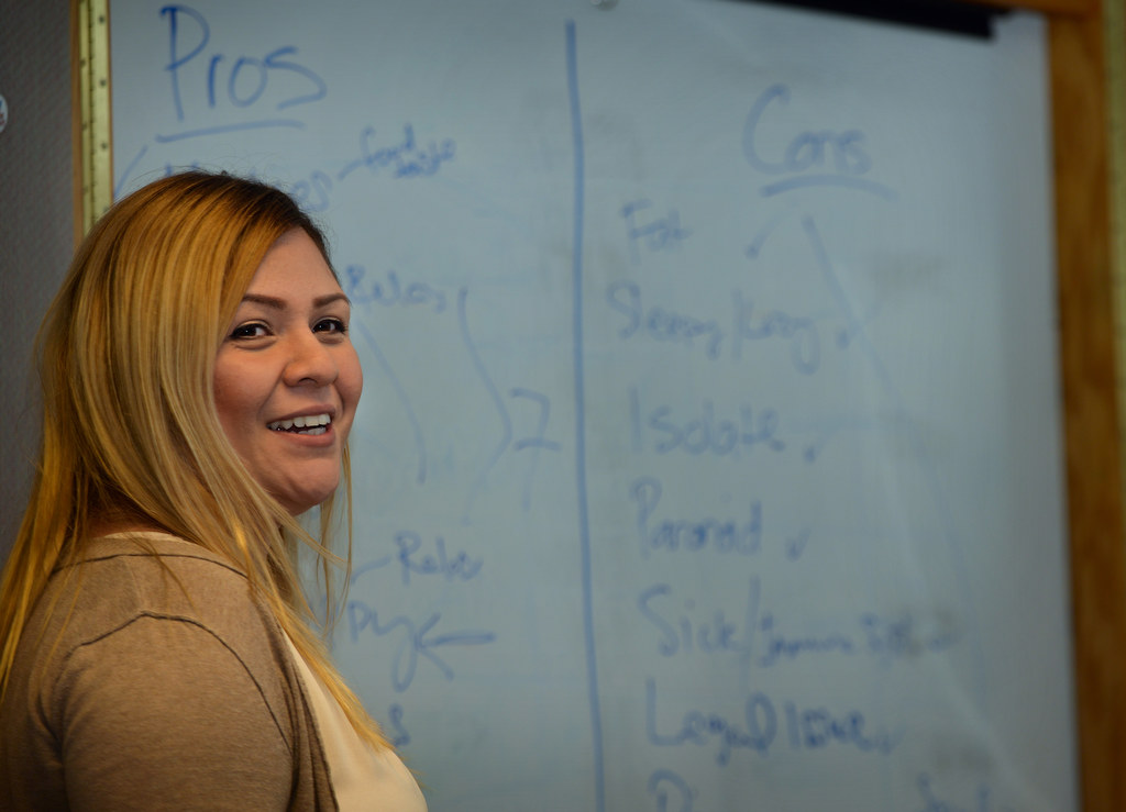 Lily Dueñas has her class come up with a list of pro’s and con’s of marijuana use during a marijuana support class, part of the Boys and Girls Clubs of Garden Grove’s Family and Youth Outreach Program at the Juvenile Justice Center in Garden Grove. Photo by Steven Georges/Behind the Badge OC
