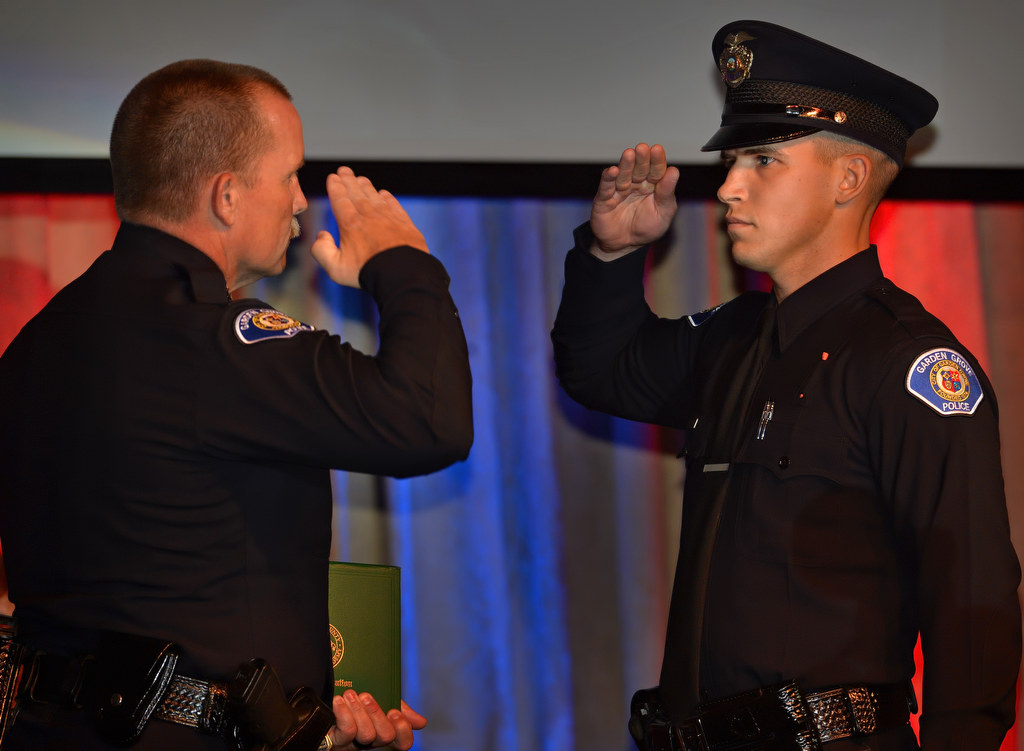 Garden Grove Police Chief Todd Elgin salutes Garden Grove’s new officer Michael Gerdin during the OCSRTA class of 216’s graduation ceremony. Photo by Steven Georges/Behind the Badge OC