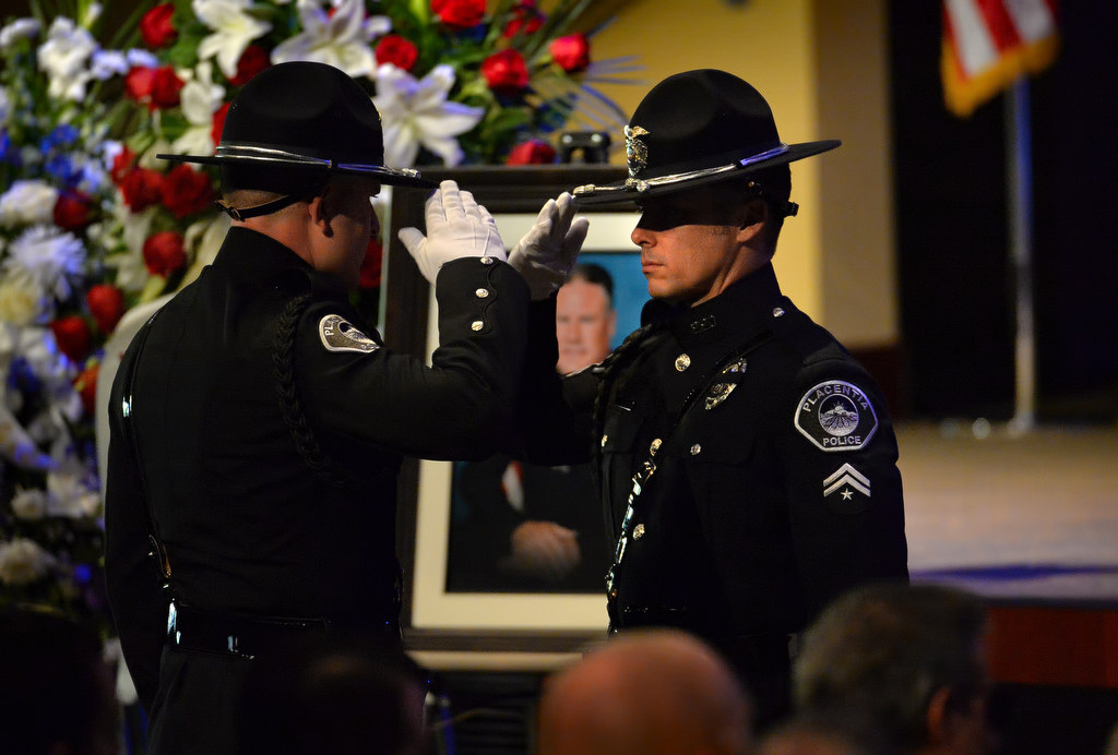 Honor Guards from Brea PD salute as they change watch over the casket of Brea PD Officer Daniel McKinley during funeral services at Evangelical Free Church in Fullerton. Photo by Steven Georges/Behind the Badge OC
