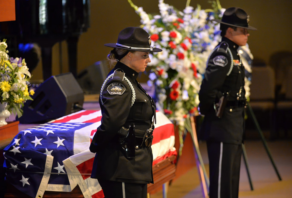 Honor Guards from Brea PD stand watch over the casket of Brea PD Officer Daniel McKinley during funeral services at Evangelical Free Church in Fullerton. Photo by Steven Georges/Behind the Badge OC