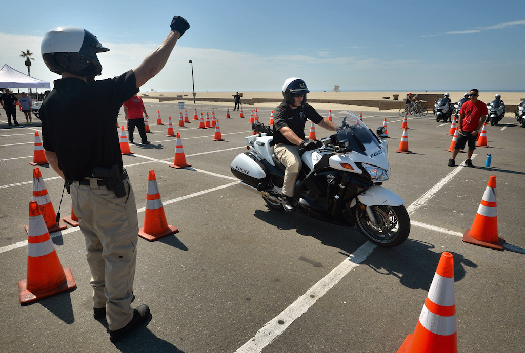 Tustin PD’s Steve Brooks rides through an obstacle course during the Orange County Traffic Officers' Association’s annual Police Motorcycle Training and Skills Competition at Huntington State Beach. Photo by Steven Georges/Behind the Badge OC