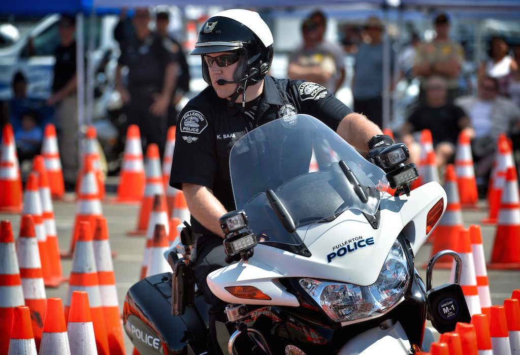 Fullerton PD Officer Kyle Baas makes his way through the obstacle course during the finals for the Orange County Traffic Officers' Association’s annual Police Motorcycle Training and Skills Competition at Huntington State Beach. Photo by Steven Georges/Behind the Badge OC