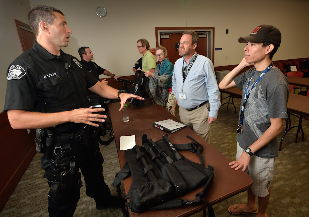 Tustin PD Officer Matt Roque talks about the equipment officers use and the appropriate times to use them at the conclusion of a Use of Force seminar for citizens at the Tustin Civic Center. Photo by Steven Georges/Behind the Badge OC
