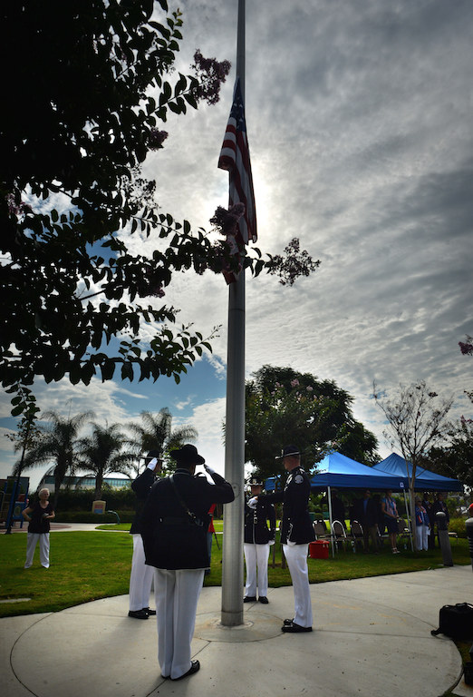 The Westminster Police Honor Guard salutes the flag as it is raised during Westminster’s 9/11 Remembrance ceremony at the Sid Goldstein Freedom Park. Photo by Steven Georges/Behind the Badge OC