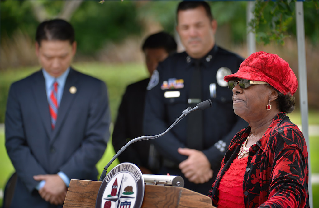 Pastor Rosie Wilkins gives the benediction with Westminster Mayor Tri Ta and Deputy Chief Dan Schoonmaker behind her at the conclusion of Westminster’s 9/11 Remembrance ceremony at the Sid Goldstein Freedom Park. Photo by Steven Georges/Behind the Badge OC