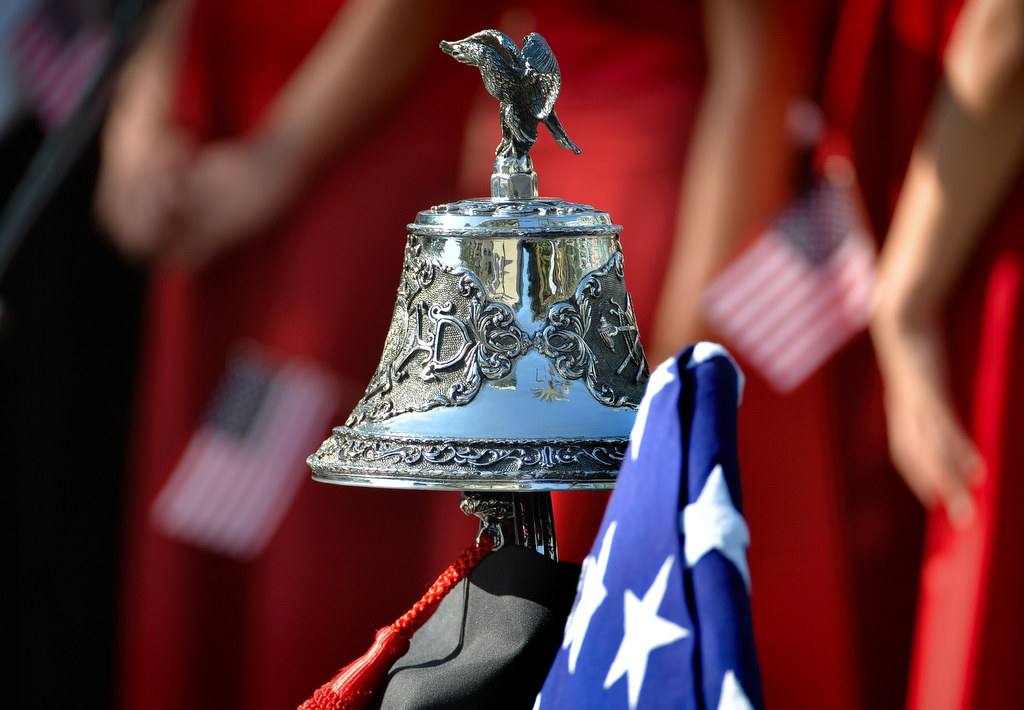 The bell and American flag on display during the 2015 9/11 Remembrance Ceremony at Anaheim Grand Plaza. Photo by Steven Georges/Behind the Badge OC
