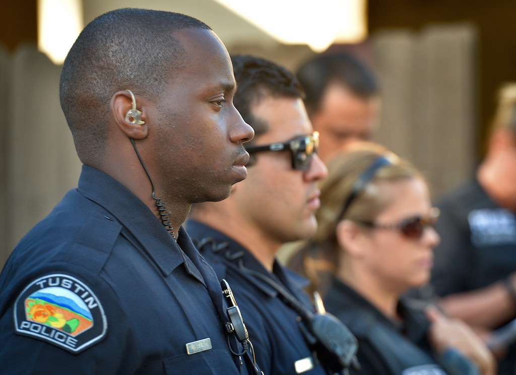 Tustin Police Officer Robert Nelson, left, joins other PD officers at the command center for a Crime Impact Team briefing before heading out to target areas. Photo by Steven Georges/Behind the Badge OC
