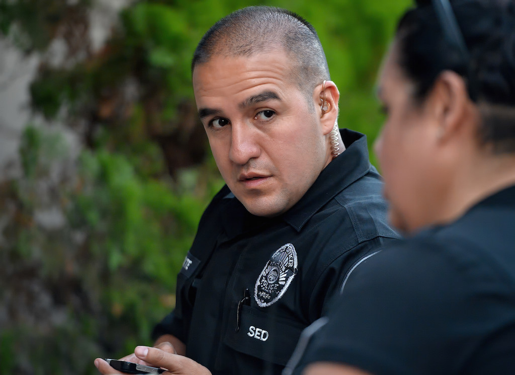 Tustin PD Sgt. Manny Arzate works with probation officers on the Special Enforcement Detail team as they check on probationers. Photo by Steven Georges/Behind the Badge OC