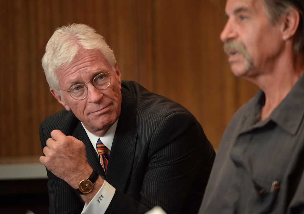 Attorney Lloyd Freeberg of Sobriety Law in Fullerton, left, listens as Bill Easton of Fullerton talks about his recovery from a life of Meth. Photo by Steven Georges/Behind the Badge OC