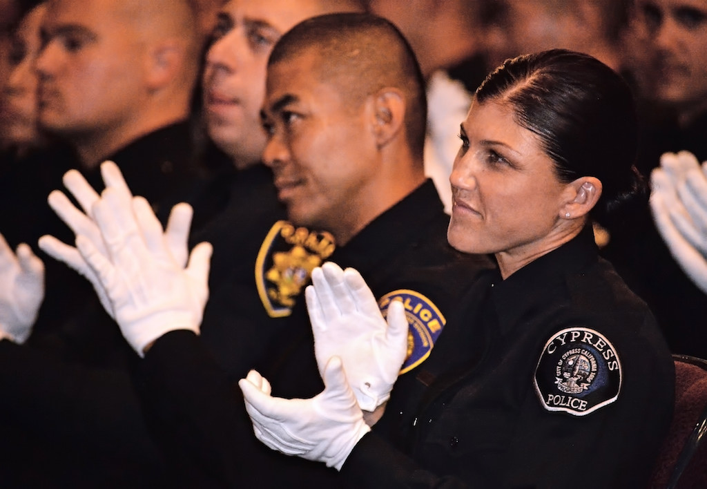 Cypress PD’s Melissa Grove, right, with her classmates during the Golden West College Criminal Justice Training Center’s Basic Police Academy, Class 150, graduation ceremony. Grove would later receive the Director’s Award. Photo by Steven Georges/Behind the Badge OC