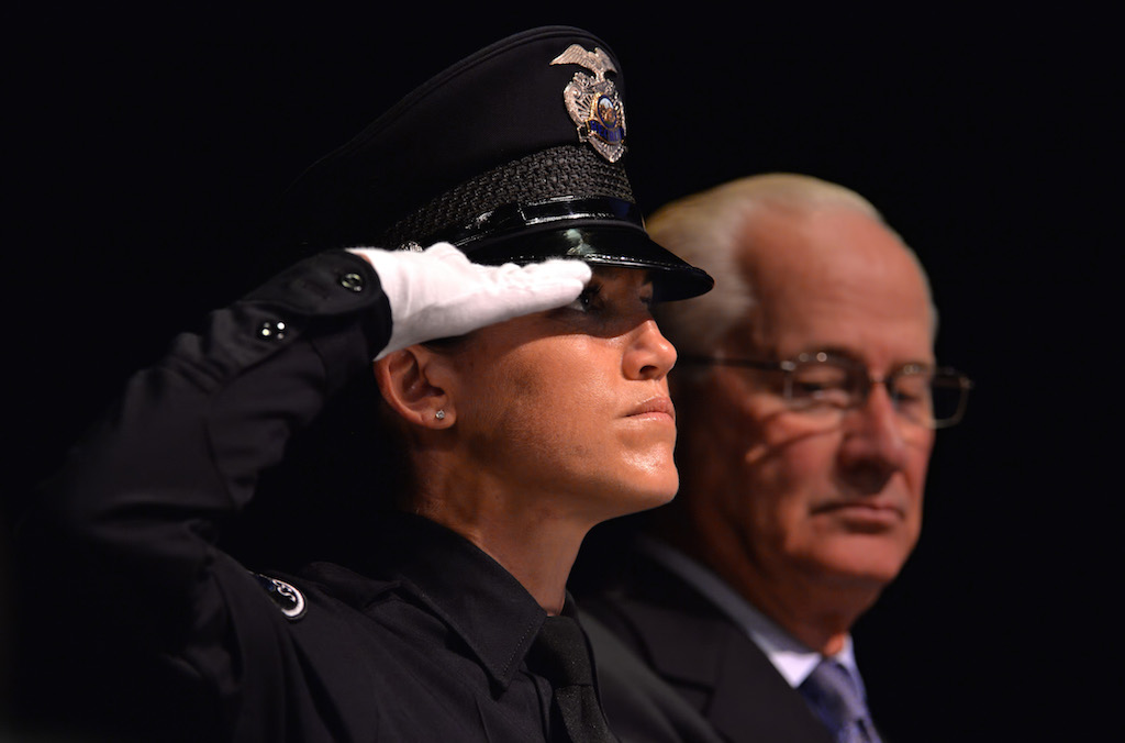 Vice President Class 150 Melissa Grove salutes during the playing of the National Anthem at the Golden West College Basic Police Academy, Class 150, graduation ceremony. Photo by Steven Georges/Behind the Badge OC