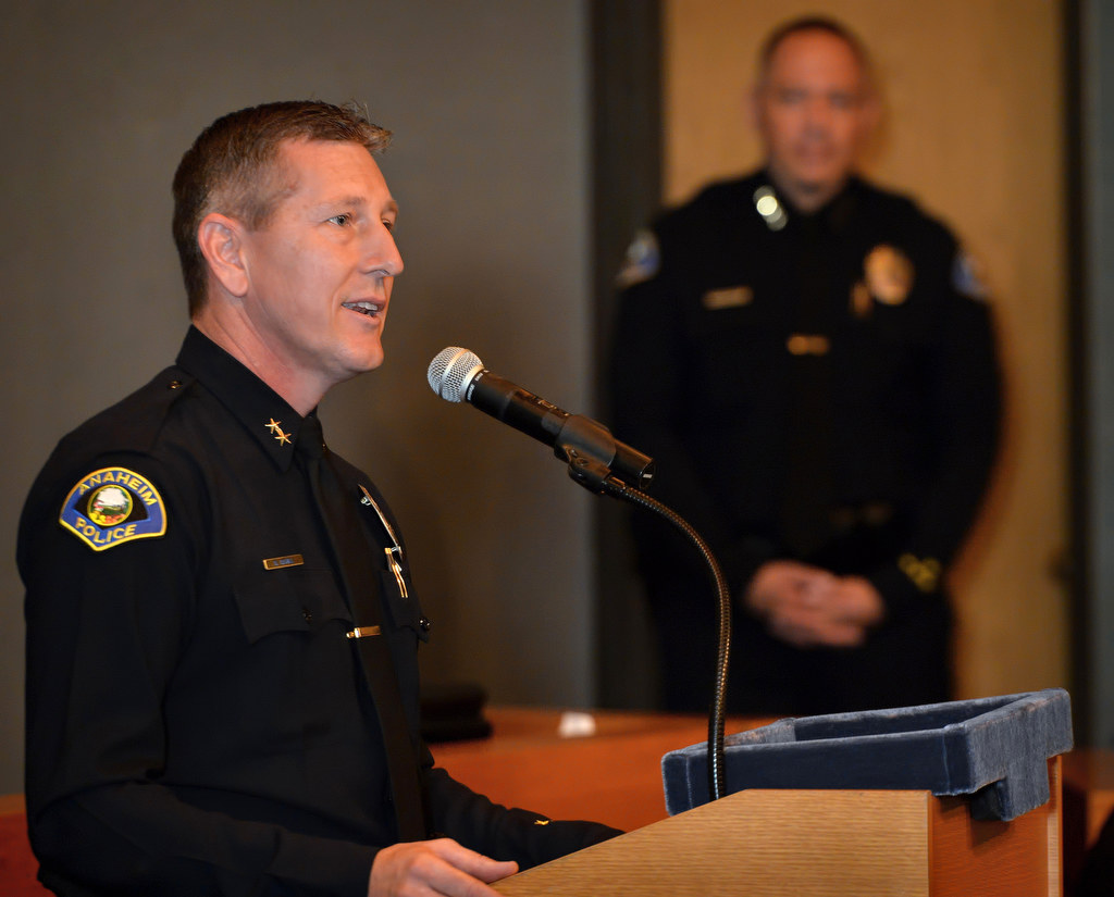 Dan Cahill, Anaheim’s new deputy chief, talks about how a police department is like family during a swearing in ceremony at Anaheim City Hall. Photo by Steven Georges/Behind the Badge OC
