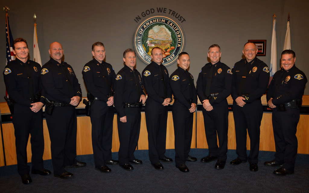 Anaheim PD’s command staff, including Deputy Chief Julian Harvey, left, and Police Chief Raul Quezada, second from right, welcome Anaheim’s newest members to the Anaheim PD. Officer John Pasqualucci, fifth from left, Officer Bartman Horn, sixth from left, and Dan Cahill, Anaheim’s new Deputy Chief. Photo by Steven Georges/Behind the Badge OC