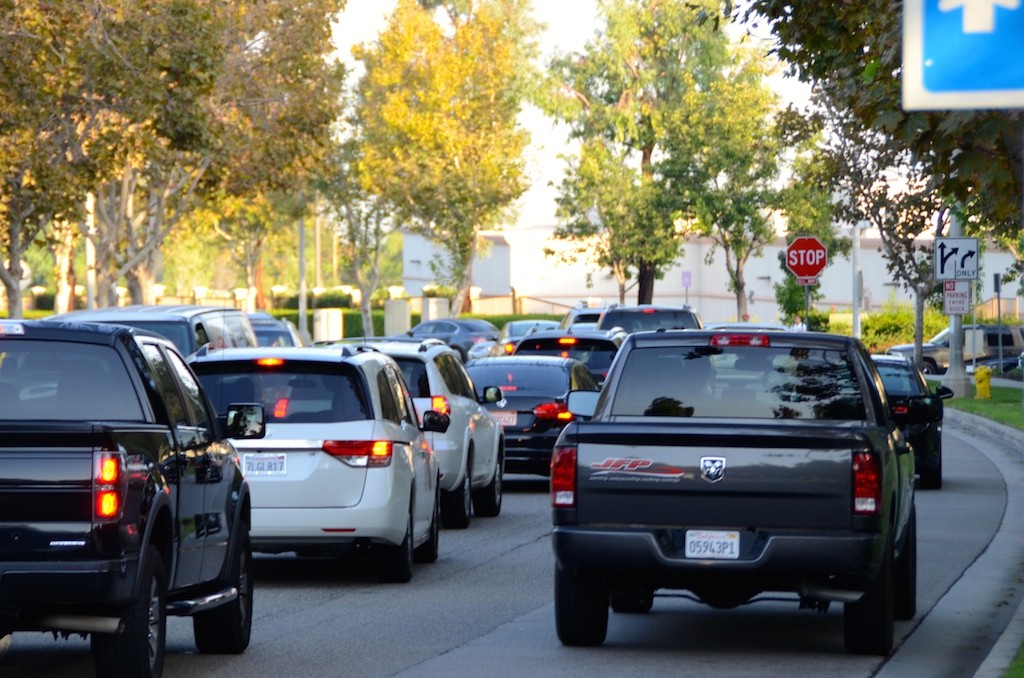 Hundreds of cars jockey for position as they line up to drop off kids at school. Photo by Joe Vargas