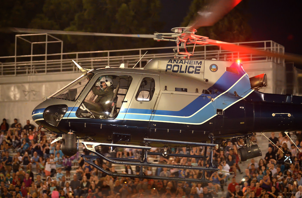An Anaheim PD Angel helicopter hovers over Glover Stadium to a cheering crowd during the OCPCA’s 27th Annual Police K-9 Benefit Show in Anaheim. Photo by Steven Georges/Behind the Badge OC