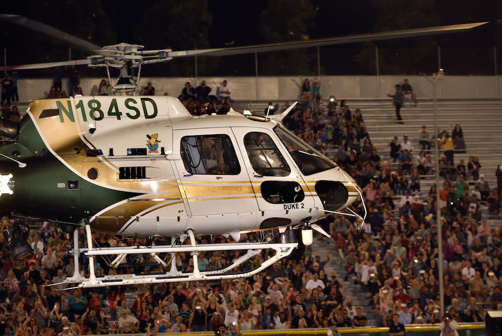 An Orange County Sheriff helicopter hovers over Glover Stadium to a cheering crowd during the OCPCA’s 27th Annual Police K-9 Benefit Show in Anaheim. Photo by Steven Georges/Behind the Badge OC