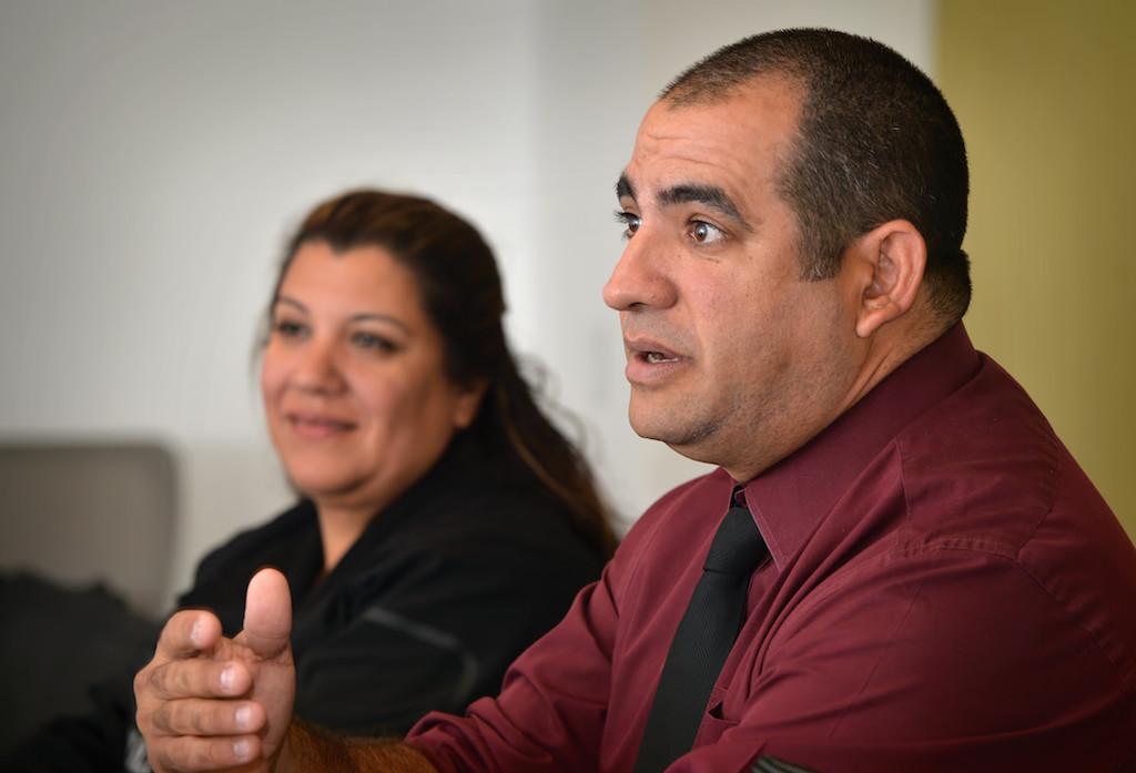 Westminster PD Detective Rafaelo Papale, right, and Detective Adriana Villezcas, behind him, talk about their experiences working with domestic violence and and what the department is doing to help the victims. Photo by Steven Georges/Behind the Badge OC