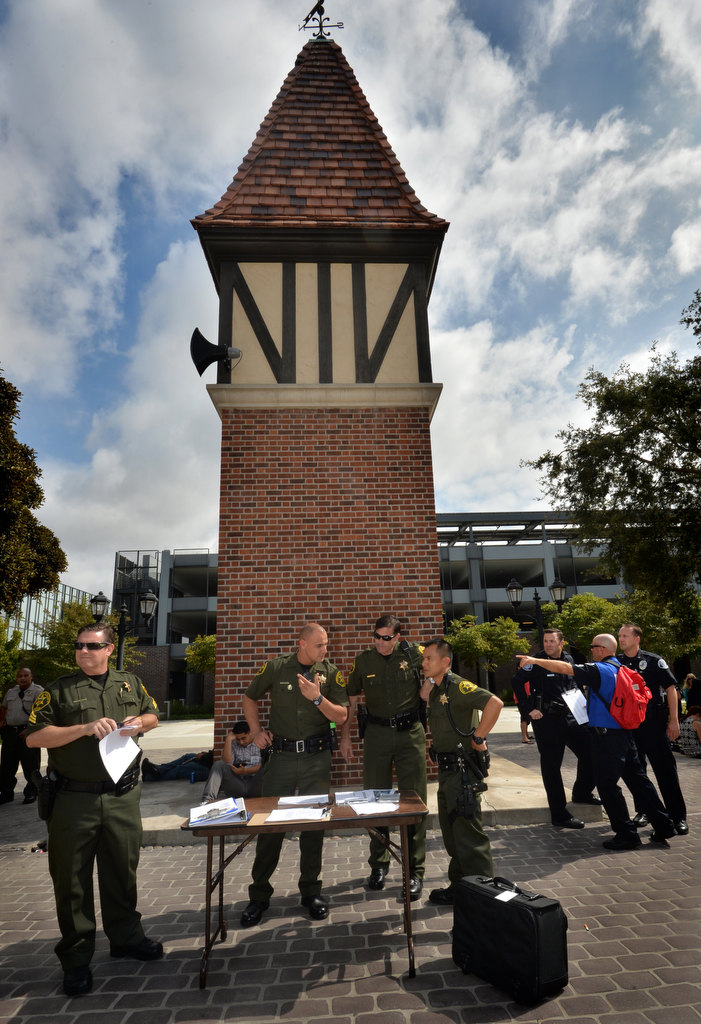 Members of the Orange County Sheriff Department setup outside as people gather at designated areas during the civic center’s earthquake drill. Photo by Steven Georges/Behind the Badge OC