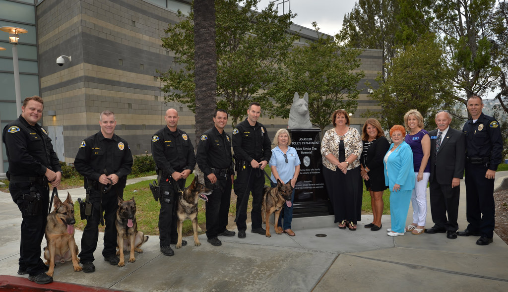 Supporters stand with Anaheim PD K-9 handlers in front of Anaheim PD’s new Police Service Dog Memorial at APD’s East Sub Station. Photo by Steven Georges/Behind the Badge OC