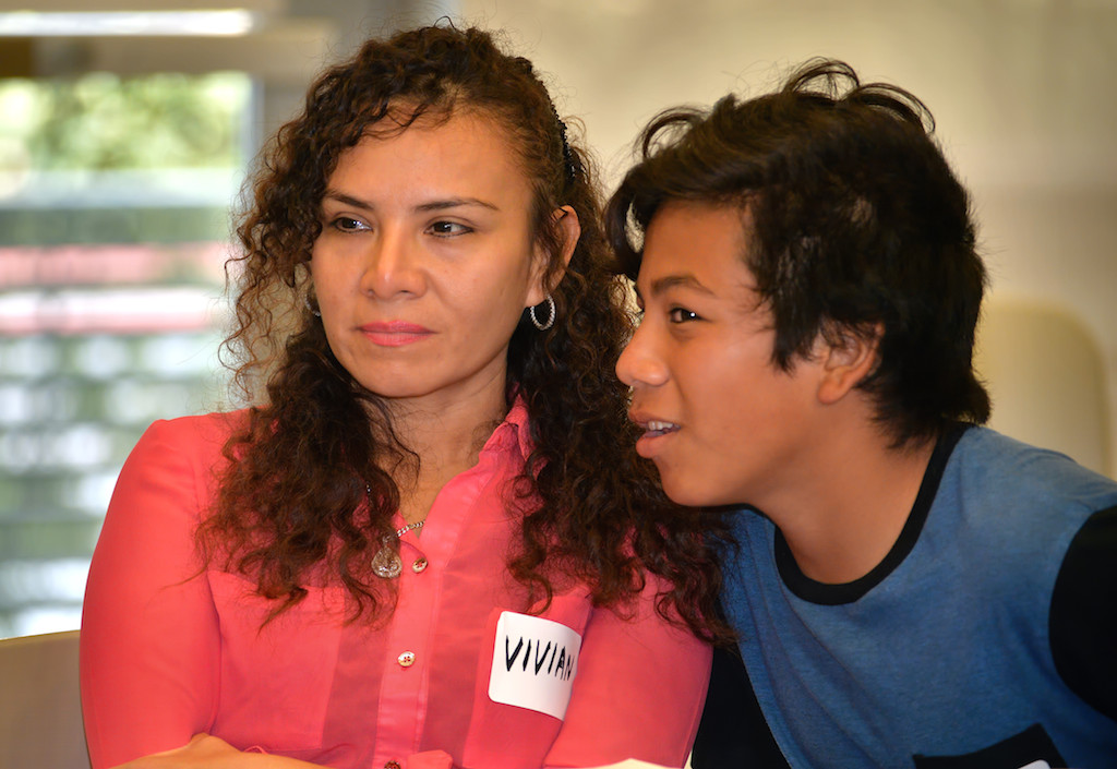 Viviana Mondragon of Fullerton talks to her 13-year-old son Joseph Espinoza as Fullerton PD’s first ever Teen and Parent Conference gets under way. Photo by Steven Georges/Behind the Badge OC
