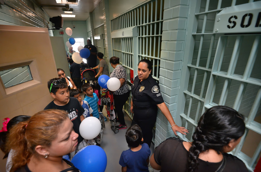 Records Specialist Viviana Alfaro of the La Habra PD gives a tour of the LHPD’s jail cells, as part of an overall tour, during La Habra PD’s open house. Photo by Steven Georges/Behind the Badge OC