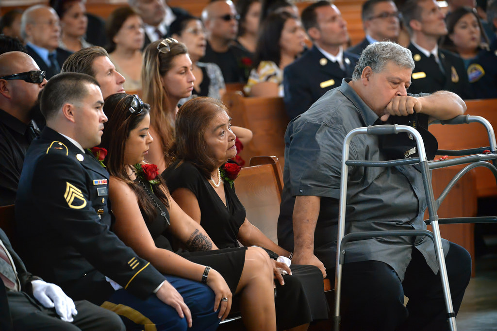 Family members attend the memorial service for Metro Net Dispatcher John Delgado at La Purisima Catholic Church in Orange. Photo by Steven Georges/Behind the Badge OC