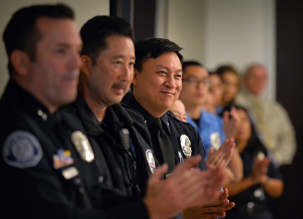 Westminster police personnel, including Commander Timothy Vu, third from left, applaud the veterans at the conclusion of a Veterans Day ceremony at the Westminster Police Department. Photo by Steven Georges/Behind the Badge OC