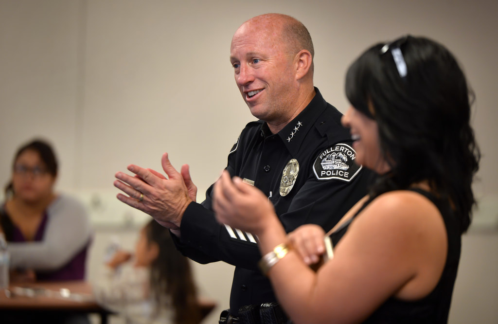 Fullerton Police Chief Dan Hughes and Topaz Elementary Principal Monica Barrera congratulate the families of students who received honored from the school’s GRIP program during a gathering at the school. Photo by Steven Georges/Behind the Badge OC
