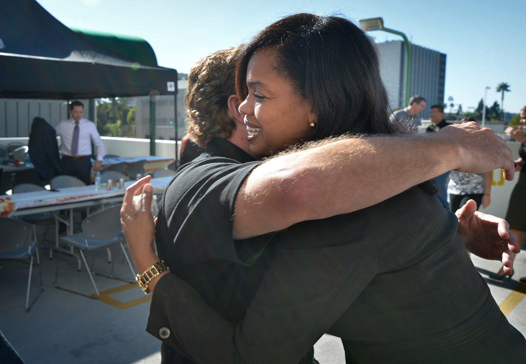 Fullerton PD Det. Joel Craft gives a hug to Tamika Williams as friends gather to honor her and remember her 10-year-old son, Jordan Williams, who passed away from Leukemia two years ago. Photo by Steven Georges/Behind the Badge OC