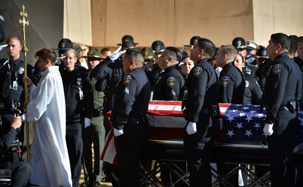 Pallbearers from the Downey police carry the casket of Downey PD Officer Ricardo "Ricky" Galvez into the Cathedral of Our Lady of the Angels in downtown Los Angeles for funeral services. Photo by Steven Georges/Behind the Badge OC