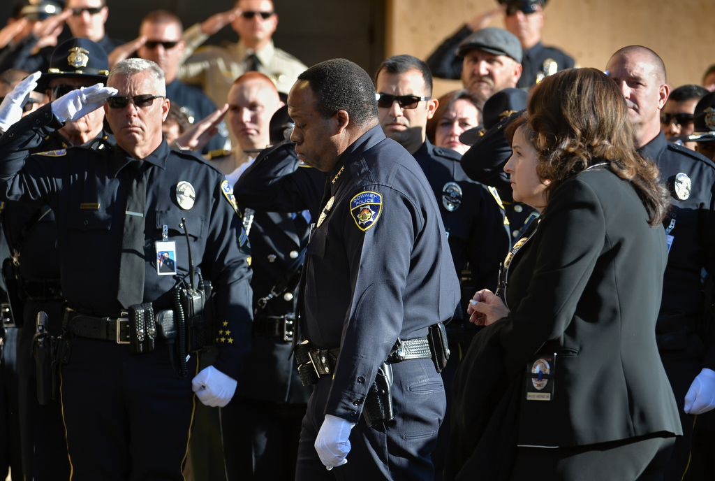 Downey Police Chief Carl Charles leads the family of slain Downey PD Officer Ricardo "Ricky" Galvez into the Cathedral of Our Lady of the Angels in downtown Los Angeles for funeral services. Photo by Steven Georges/Behind the Badge OC