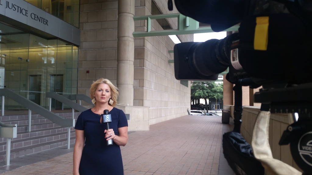 Kerry O'Brien outside the courthouse in June in Tarrant County, Texas covering the Geronimo Aguilar trial. Photo courtesy of O'Brien