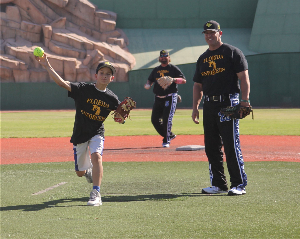 Kyle Scollo, 12, throws out the opening pitch at the PoliceSoftball.com World Series in Las Vegas. Photo courtesy PoliceSoftball.com 