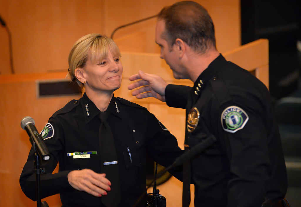 Julia Engen, left, is congratulated by Irvine Police Chief Mike Hamel after she was sworn in sworn in as Irvine PDÕs new deputy chief during a ceremony at Irvine City Hall. Photo by Steven Georges/Behind the Badge OC
