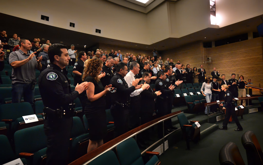 Julia Engen, bottom right, receives a standing ovation after being sworn in as Irvine PD’s new deputy chief at the Irvine’s City Council Chambers. Photo by Steven Georges/Behind the Badge OC