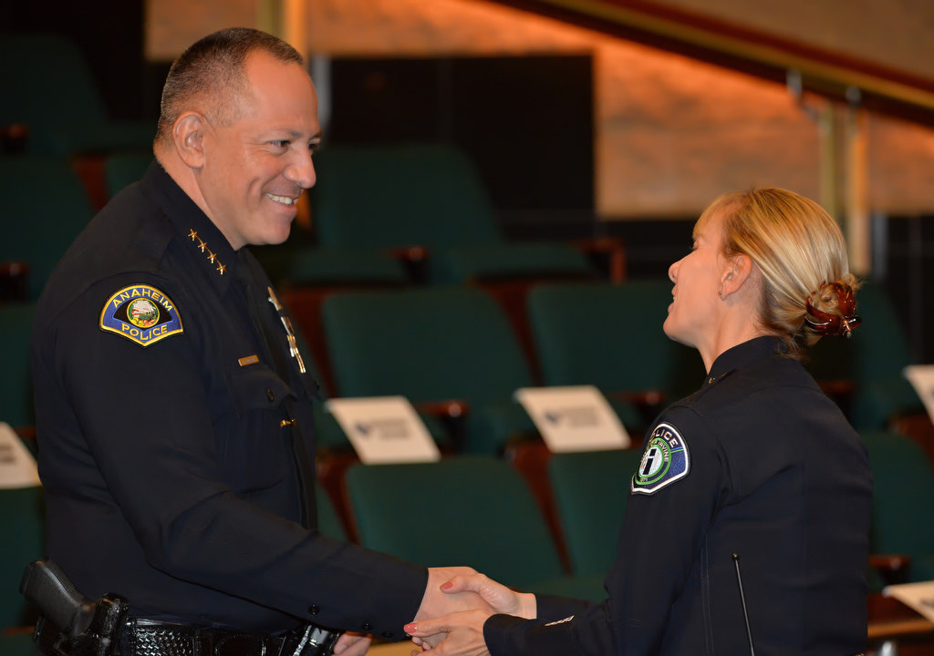 Anaheim Police Chief Raul Quezada congratulates Julia Engen after she was sworn in as Irvine PD’s new deputy chief. Photo by Steven Georges/Behind the Badge OC